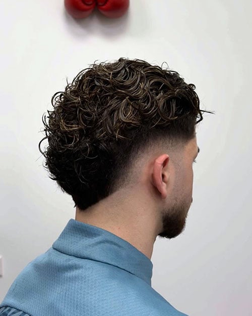 Messy Slick Back with Burst Fade